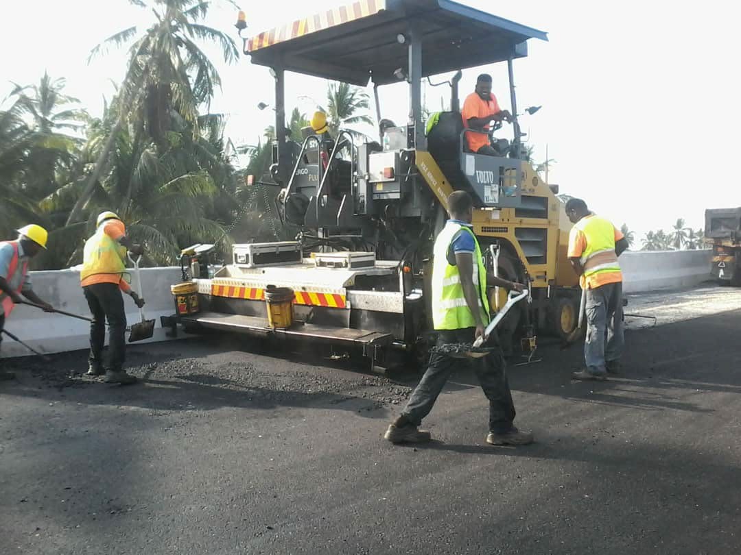 Jayaland crew laying premix on a road